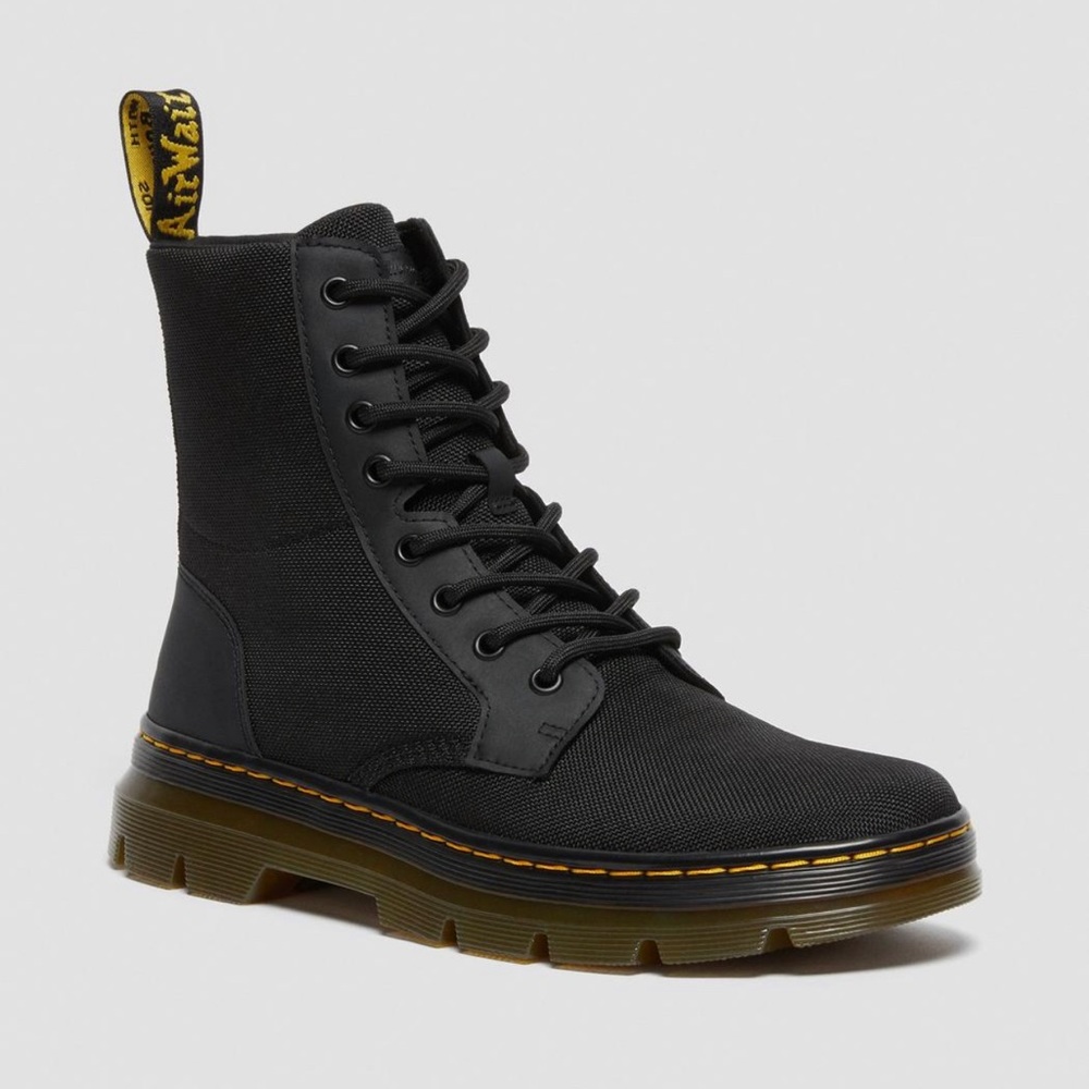 Black Dr. Martin tie up boots.